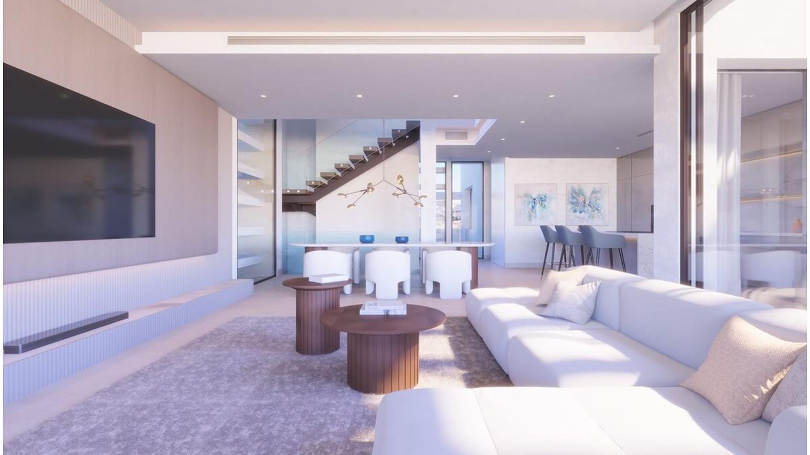 Modern villa interiör med vardagsrum, matbord och trappa.